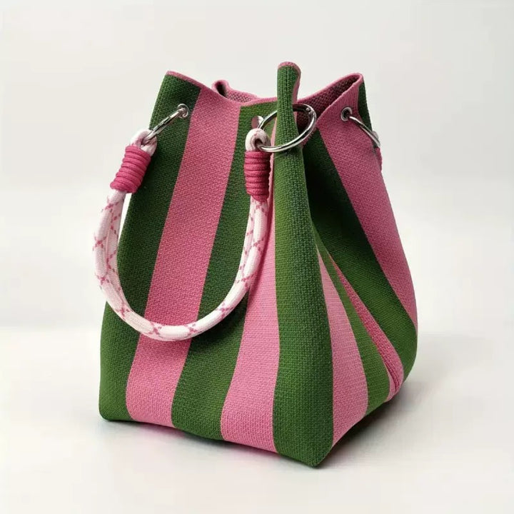 Knit bucket tote in pink and green striped pattern with white rope handle